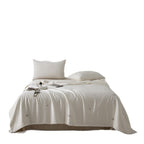 Silk bed cover made of microfiber with subtle embroidery and ultra-light fall