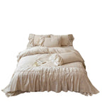 Country house style complete bedding set with voluminous bed skirt, lace trim, and fine floral embroidery