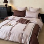 Elegant bedding set made of cotton satin with decorative pleats, bows, and lace trim