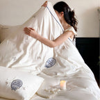 Luxurious cotton satin bedding set with embroidered butterfly appliqués and fine piping