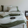Luxurious cotton satin bedding set with decorative borders and decorative pillows