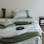 Luxurious cotton satin bedding set with decorative borders and decorative pillows