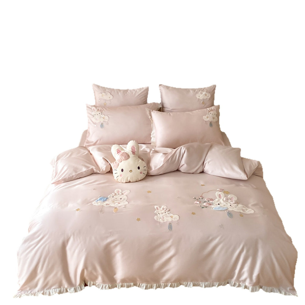 Playful children's bedding set made of silky-soft cotton satin with appliquéd bunnies and cuddly pillow