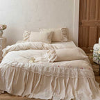 Country house style complete bedding set with voluminous bed skirt, lace trim, and fine floral embroidery