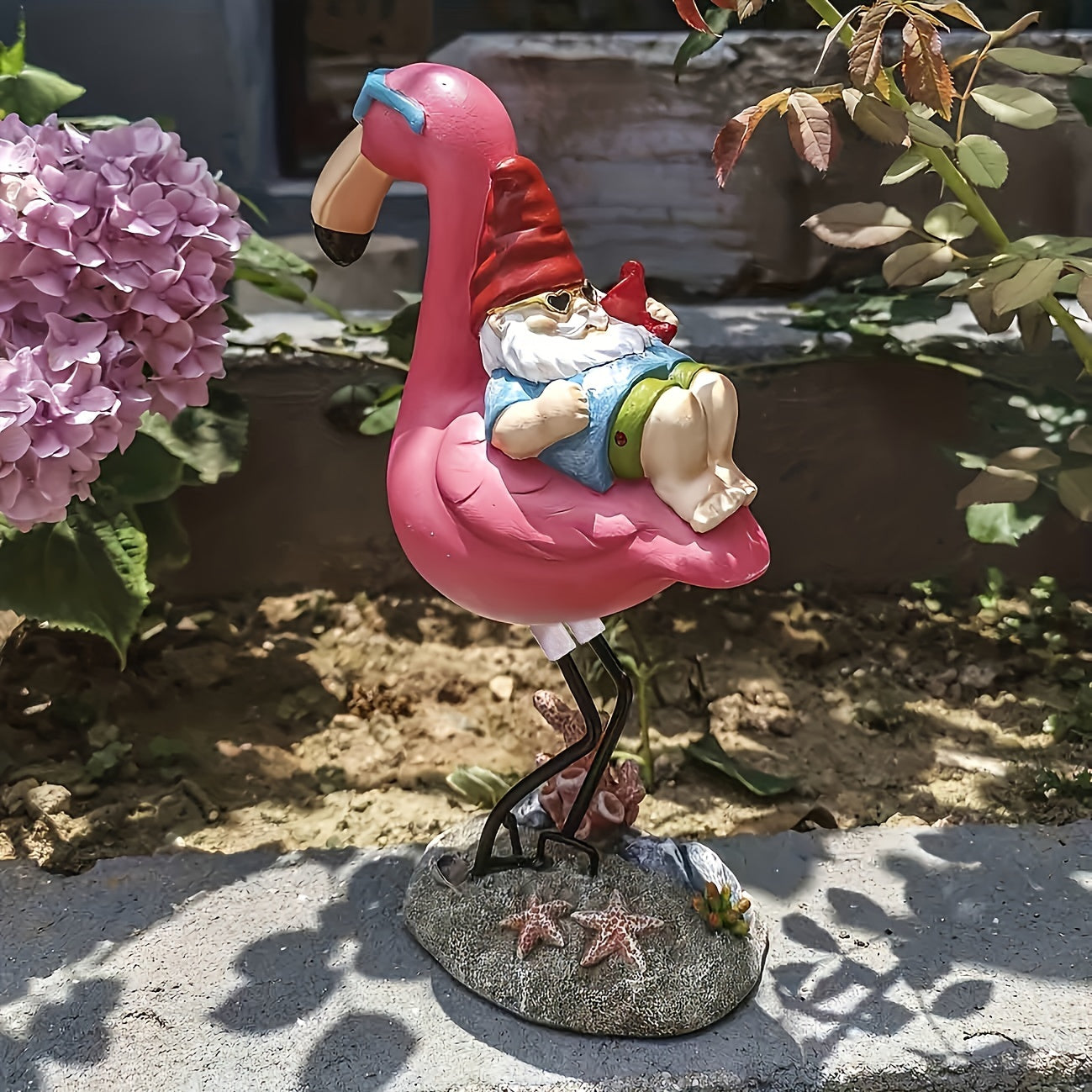 Flamingo relaxing garden gnome statue