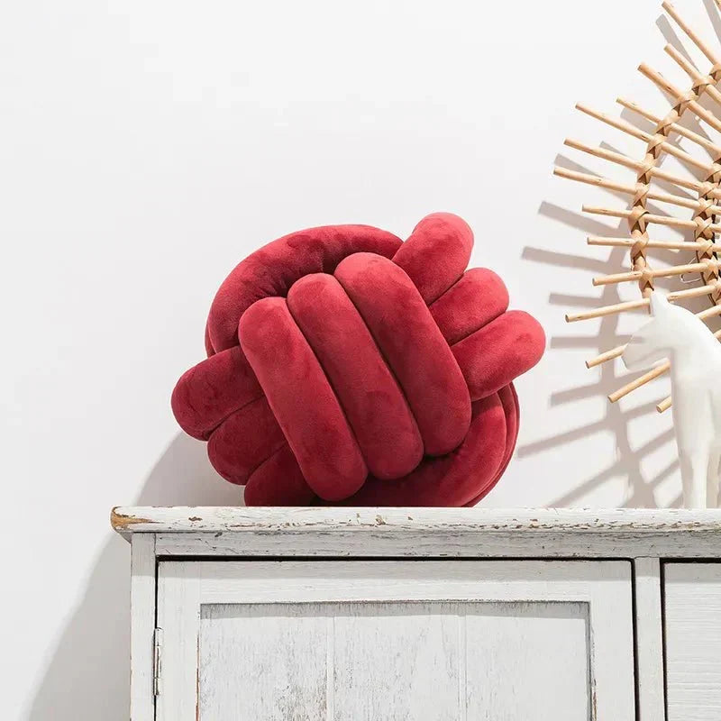 Decorative, soft cushion with knotted ball in suede look
