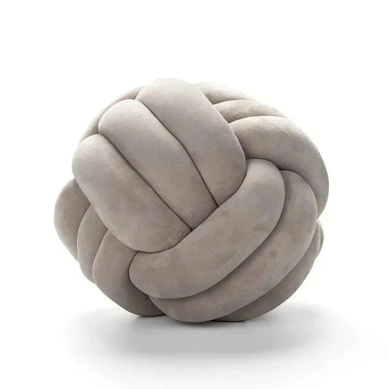 Decorative, soft cushion with knotted ball in suede look