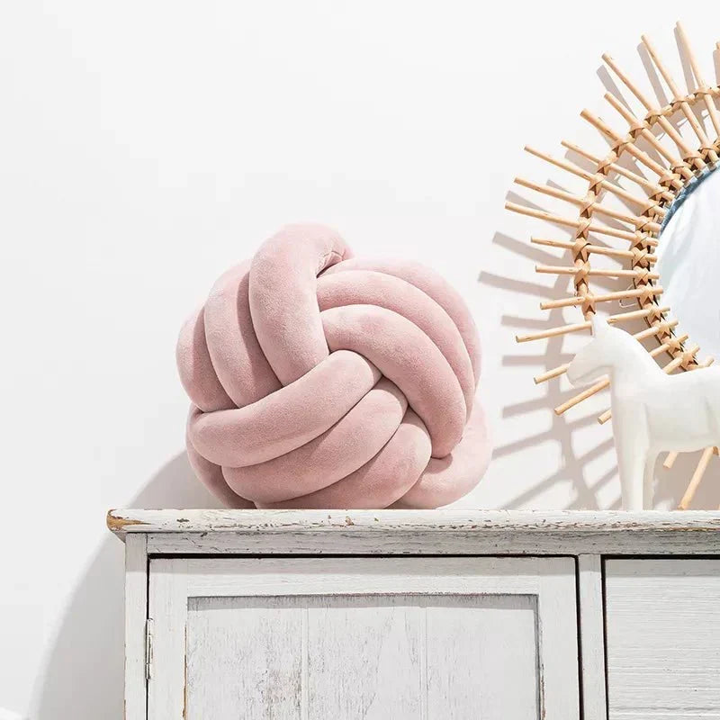 Decorative, soft cushion with knotted ball in suede look