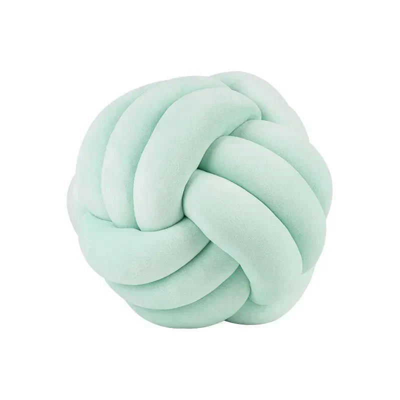 Decorative, soft cushion with knotted ball in suede look