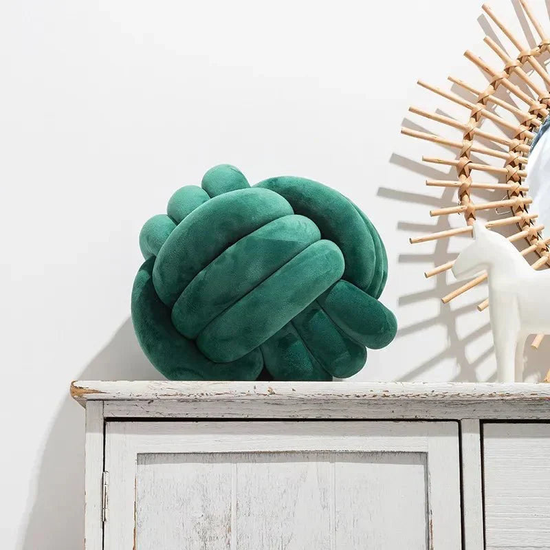 Decorative, soft cushion with knotted ball in suede look