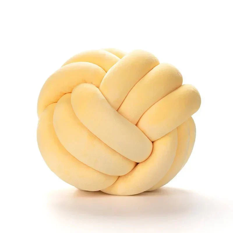 Decorative, soft cushion with knotted ball in suede look